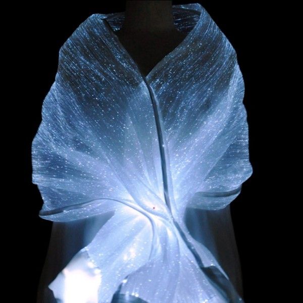 Light-emitting textile draped to form a glowing piece of clothing.
