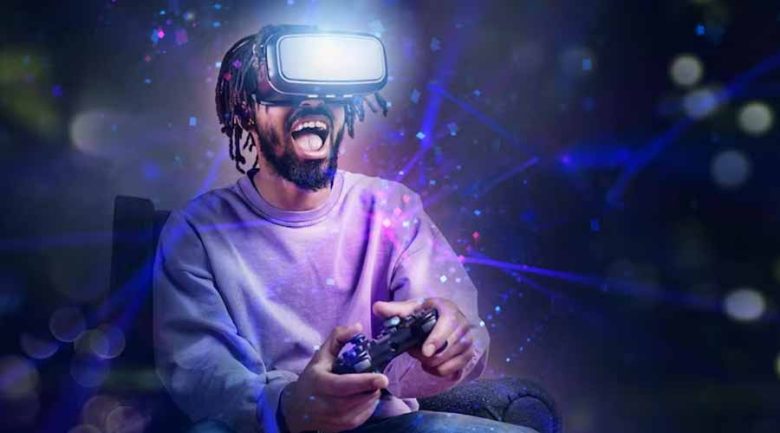 A man wearing a VR headset and holding a controller surrounded by digital light effects.