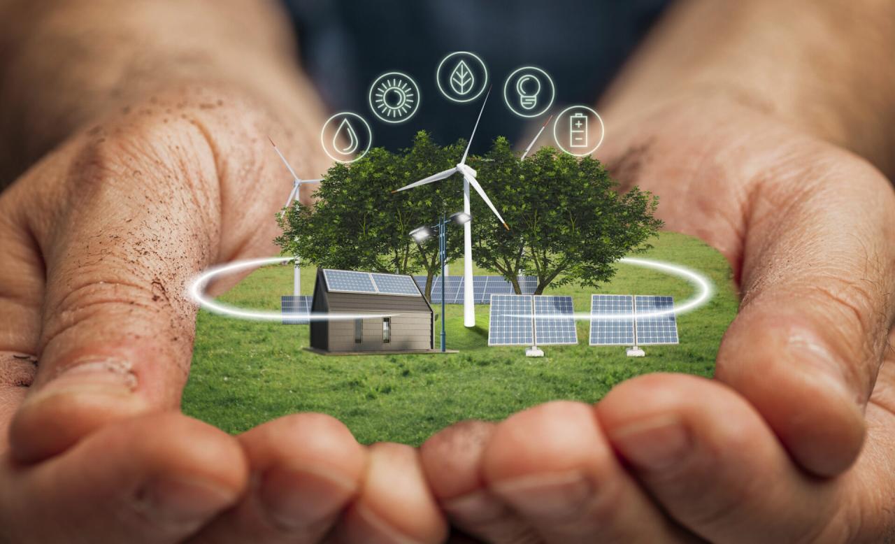 Concept of green energy and sustainable living held in someone's hands.