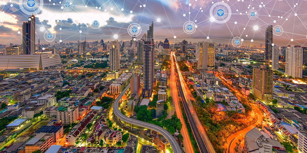 Panoramic shot of an interconnected urban environment, showing the fusion of architectural development with advanced wireless network technology.